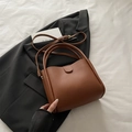 Chic caramel brown faux leather bucket bag with top handles and adjustable strap - Brown