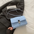 Light blue V-quilted chain shoulder bag with silver turn-lock and metallic strap - Blue