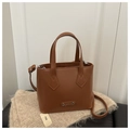 Brown leather tote bag with top handles, adjustable strap and metal logo detail - Tan