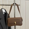 Chic brown leather underarm bag with gold metal buckle for 2025 summer trend style - Brown