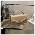 Elegant beige square handbag with a gold twist lock and a top handle in a minimalist style - Khaki