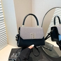 Elegant two-tone tote bag with black leather, grey fabric, and golden geometric lock - Black