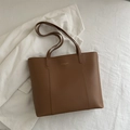 Minimalist large brown tote bag with fashion gold lettering on a chic striped background - Tan