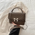Vintage pattern shoulder bag with a silver bow buckle and elegant metal chain strap - Vintage Monogram Coffee