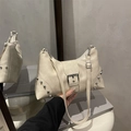 Large capacity beige rivet dumpling bag in glossy leather with silver stud accents - White