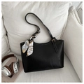 Detail of black tote bag with white contrast stitching and decorative geometric silk scarf - Black