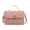 Pink saddle crossbody bag featuring a woven texture flap and silver horseshoe buckle - Pink