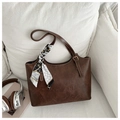 Detail of dark brown tote bag with vintage texture and elegant patterned silk scarf - Dark Brown