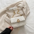 Chic white quilted crossbody bag with golden horseshoe buckle and chain strap - White