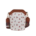 White bucket bag with red cherry print and bohemian wide woven shoulder strap - Brown