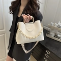 White faux leather bucket bag with gold U-shaped handle and fashion lettering - White