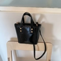 Black glossy patent leather mini bucket bag with gold rivets and crossbody strap - Black