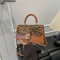 Brown faux leather crossbody bag with leopard print flap and golden metal lock - Brown