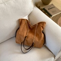 Brown suede tote bag with chain strap and drawstring detail on a beige sofa - Brown - Without Pendant
