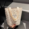 Corduroy tote bag with heart bow patterns and a minimalist logo label on the front - Off White