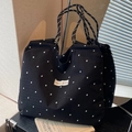 Schwarze Canvas-Tasche mit weißen Blumenmustern und Schultergurten aus Seilgeflecht - Schwarz