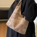 Retro brown oversized bucket bag with textured finish and silver buckle on wide strap - Coffee