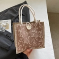 Pinkish brown canvas lunch bag featuring embossed butterfly design and rope handles - Khaki