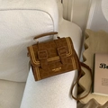Brown leopard print handbag with gold studs and adjustable strap on a sofa - Brown - Without Pendant