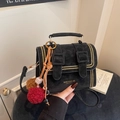 Elegant black suede Cambridge crossbody bag with gold stud trim and plush charm - Black With Plush Ball Charm