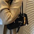 Black matte shoulder bag with gold clasp and tri-color beaded charm detail - Black With Bead Charm