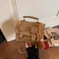 Retro tan faux leather satchel with dual buckle straps and plush ball charm accessory - Khaki With Plush Ball Charm
