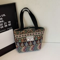 Ethnic style woven tote bag with colorful geometric patterns and black webbing handles - Black Small (Open)