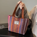 Ethnic striped fabric tote bag in orange and purple with sturdy brown woven handles - Open Top / Brown / Small