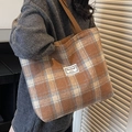 Brown checkered wool tote bag shown on model with shoulder strap and minimalist label - Large / No Pendant / Brown