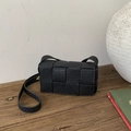 Classic black woven crossbody bag with wide intrecciato pattern and textured leather finish - Black