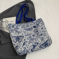 Canvas tote bag with blue butterfly print and floral pattern for daily commute - Lined With Zipper No Inner Pocket / Large / Blue