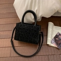 Square black tote bag with animal texture, featuring round handles and adjustable strap - No Pendant / Black