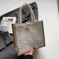 Chic beige handbag featuring floral embossed texture and a classic wooden button closure - Button Decor Style / Off White