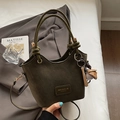 Dark olive green matte bucket bag with baseball charms and adjustable crossbody strap - Green with Baseball Charm