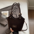 Minimalist dark brown bucket bag with dual cylindrical handles and detachable strap - Coffee No Charm