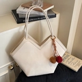 Off-white faux leather tote bag with V-shaped cut design and red tassel accent - Creamy White With Colorblock Pompom Charm