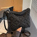 Handmade black woven straw shoulder bag with diamond pattern, fringe detail, and zipper - Black
