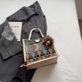 Ethnic woven tote bag with colorful geometric patterns and white cotton rope handles - Black Button Style With Brown Elf Charm