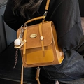 Retro mustard yellow faux suede backpack with buckle closure and baseball charm - Brown With Baseball Charm