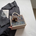 Ethnic floral print tote bag with blue base and white cotton rope handles - Blue Zipper Style With Brown Elf Charm