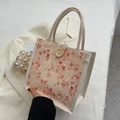 Borsa termica floreale con pizzo crema e un grande bottone decorativo in legno naturale - Arancione