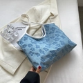 Light blue floral jacquard tote bag with white contrasting straps and elegant 3D flower texture - Blue