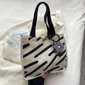 Minimalist cream canvas handbag with black stripes and checkerboard flower charm - Flower Pendant / Striped White