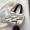 Minimalist canvas tote bag featuring black zebra stripes and metal snap closure - No Pendant / Striped White
