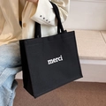 Schwarze Canvas-Tragetasche mit weißem Merci-Aufdruck für Damen Pendler und Freizeit - Schwarz