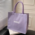 Minimalistische hellviolette Canvas-Einkaufstasche mit weißem Merci-Aufdruck - Lila
