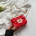 Red quilted jelly bag for girls featuring pearl handle and gold chain strap - Red