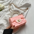 Mini pink jelly bag for girls featuring pearl handle and gold chain strap in diamond quilt - Pink