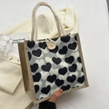 Bento-Tasche aus Leinen mit schwarz-weißen Herz-Prints und großem Holzknopf-Verschluss - Knopfdekor-Stil / Schwarz