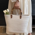 White woven tote bag featuring natural bamboo handles and elegant cotton cord texture - White